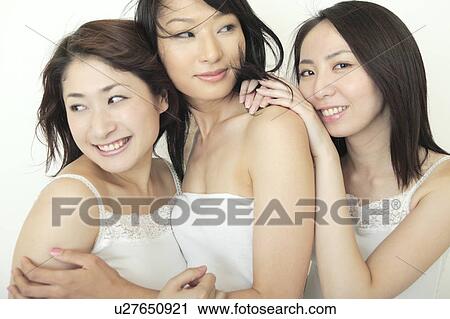 Stock Image - Three women smiling. Fotosearch