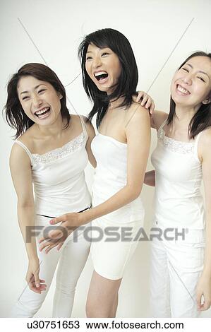 Three women smiling View Large Photo Image Stock Image - Three women smiling. Fotosearch