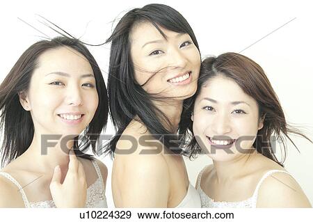 Three women smiling View Large Photo Image Stock Photo - Three women smiling. Fotosearch