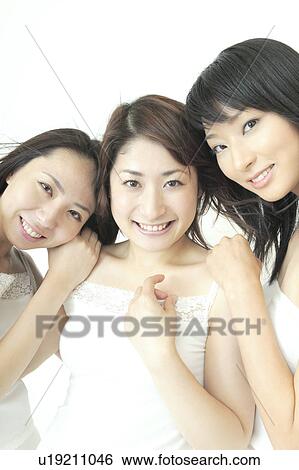 Stock Photograph - Three women smiling. Fotosearch