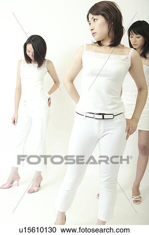 Stock Image - Three women standing. Fotosearch