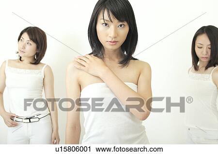 Stock Image - Three women standing. Fotosearch