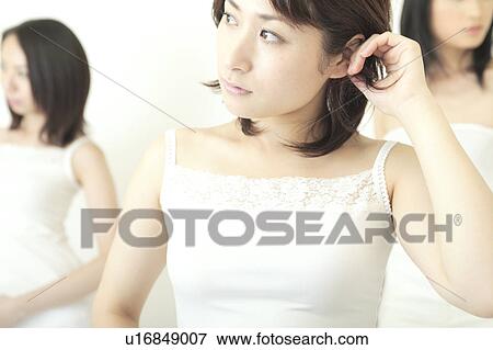 Three women standing View Large Photo Image Stock Photo - Three women standing. Fotosearch