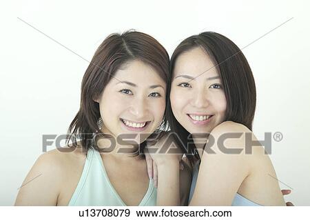Two women smiling View Large Photo Image Stock Photo - Two women smiling. Fotosearch