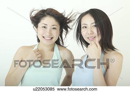 Two women smiling View Large Photo Image Stock Photography - Two women smiling. Fotosearch