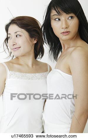 Two women standing View Large Photo Image Stock Image - Two women standing. Fotosearch
