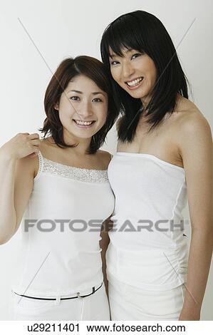 Two women standing View Large Photo Image Stock Image - Two women standing. Fotosearch