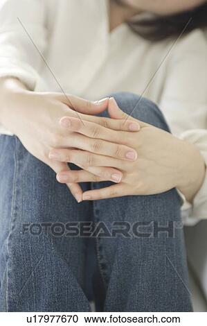 Stock Image - Unrecognizable woman sitting. Fotosearch
