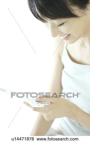 A young woman sending E-Mail View Large Photo Image Stock Photo - A young woman sending E-Mail. Fotosearch