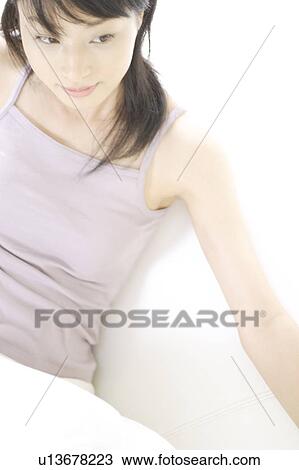 A young woman sitting View Large Photo Image Stock Image - A young woman sitting. Fotosearch