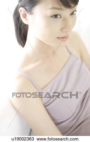 A young woman sitting View Large Photo Image Stock Image - A young woman sitting. Fotosearch