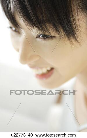 A young woman smiling View Large Photo Image Stock Image - A young woman smiling. Fotosearch