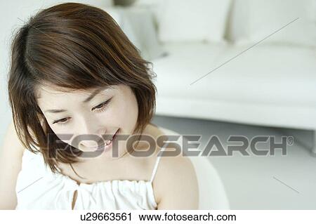 A young woman smiling View Large Photo Image Stock Image - A young woman smiling. Fotosearch