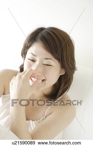 A young woman smiling View Large Photo Image Stock Photo - A young woman smiling. Fotosearch