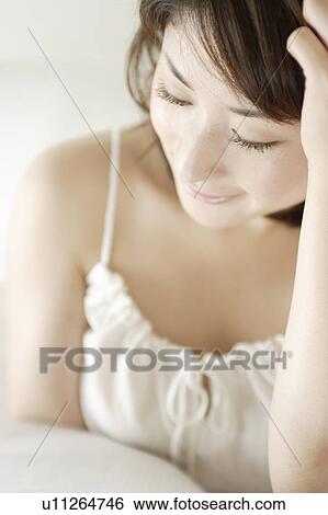 A young woman smiling View Large Photo Image Stock Photograph - A young woman smiling. Fotosearch
