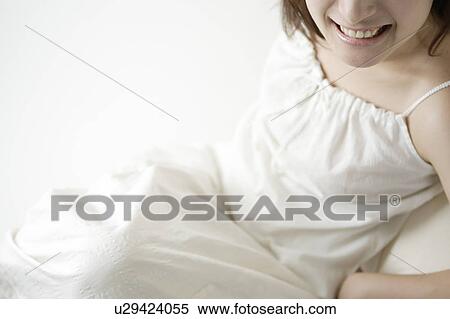 Stock Photography - A young woman smiling. Fotosearch
