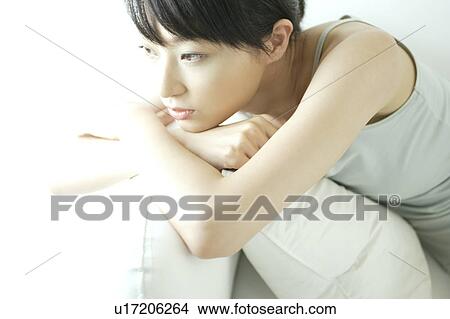 Picture - Pensive young woman. Fotosearch