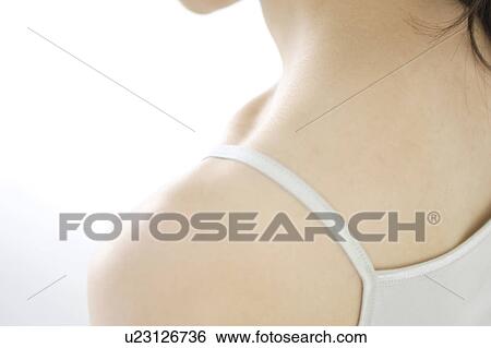 Stock Photograph - Shoulder of a young woman. Fotosearch