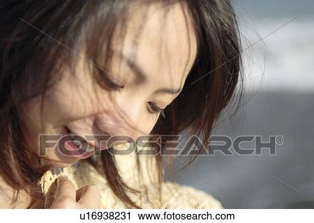 A young woman, close-up View Large Photo Image Stock Image - A young woman, close-up. Fotosearch