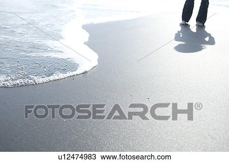 Stock Image - A young woman in beach. Fotosearch