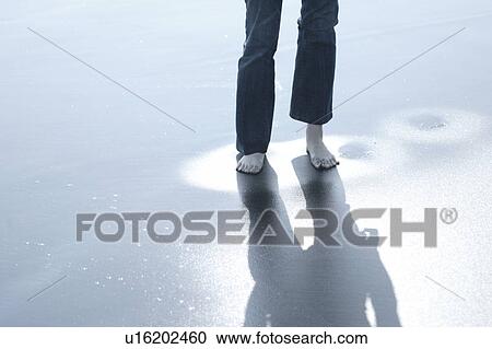 Stock Image - A young woman in beach. Fotosearch