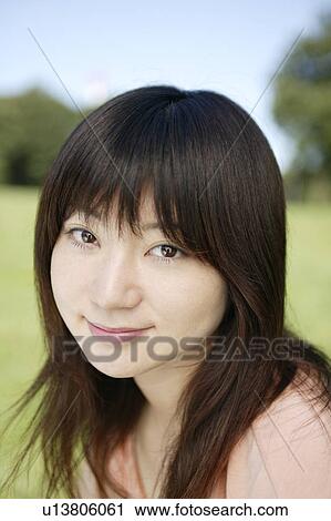 A young woman smiling View Large Photo Image Stock Image - A young woman smiling. Fotosearch