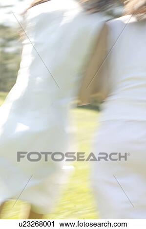 Young women running in park, rear view View Large Photo Image Stock Image - Young women running in park, rear view. Fotosearch