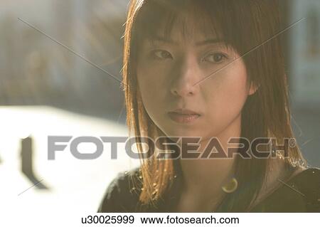 A pensive young woman View Large Photo Image Stock Photo - A pensive young woman. Fotosearch