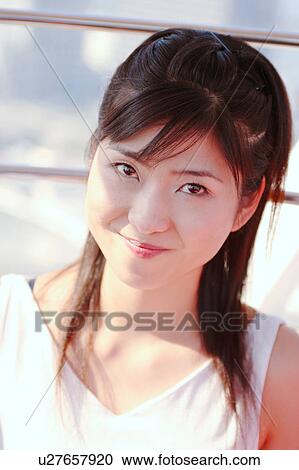 A woman smiling in Ferris Wheel View Large Photo Image Stock Image - A woman smiling in Ferris Wheel. Fotosearch