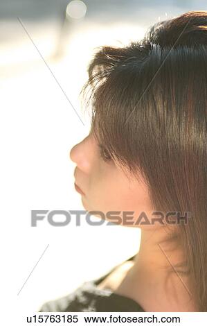 Stock Photography - A young woman, close-up. Fotosearch