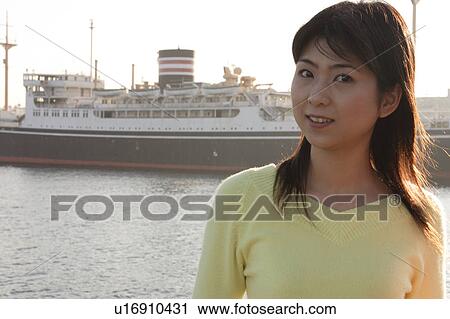 A young woman smiling View Large Photo Image Stock Image - A young woman smiling. Fotosearch