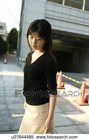 Stock Photography - A young woman walking. Fotosearch