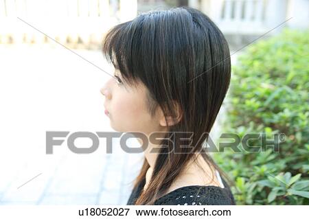 Stock Photo - Profile of a young woman. Fotosearch