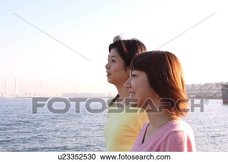 Stock Image - Profile of two young women. Fotosearch