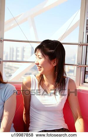Two women in Ferris Wheel View Large Photo Image Stock Photo - Two women in Ferris Wheel. Fotosearch