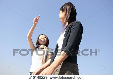 Stock Photo - Two women smiling. Fotosearch