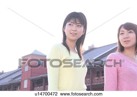 Two women standing View Large Photo Image Stock Image - Two women standing. Fotosearch