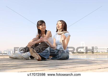 Stock Photo - Two women talking. Fotosearch