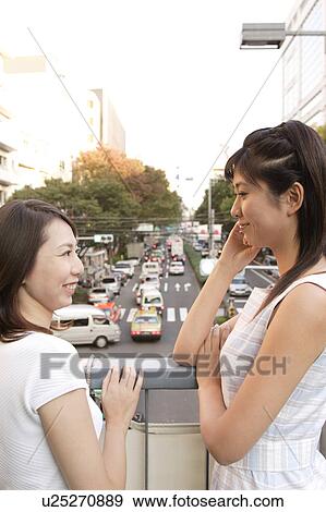 Two women talking View Large Photo Image Stock Photo - Two women talking. Fotosearch