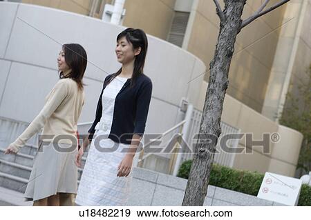 Stock Photo - Two women walking. Fotosearch