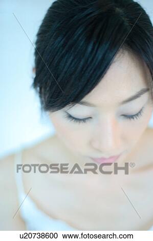 A young woman looking down View Large Photo Image Stock Image - A young woman looking down. Fotosearch