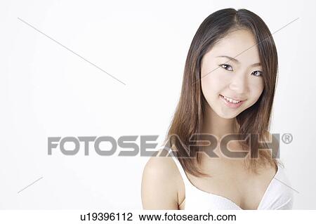 Stock Image - Portrait of a young woman in bikini. Fotosearch