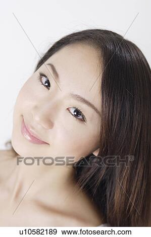 Stock Photo - Portrait of a young woman in bikini, close-up. Fotosearch