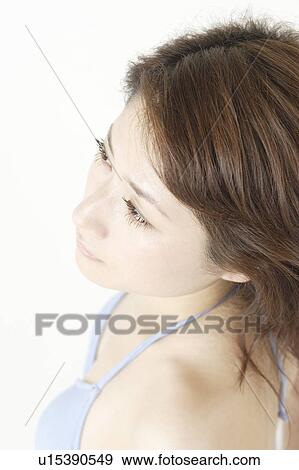 Stock Photo - Portrait of a young woman in bikini, close-up. Fotosearch
