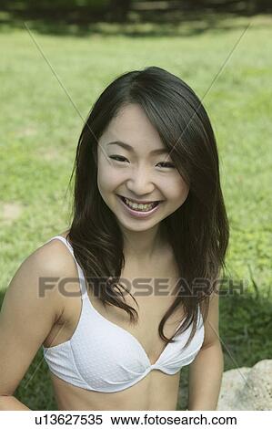 Stock Photography - Portrait of a young woman in bikini. Fotosearch