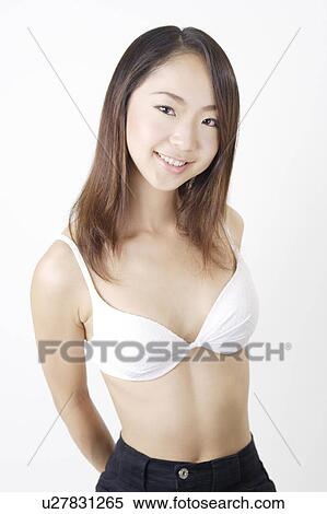 Stock Photography - Portrait of a young woman in bikini. Fotosearch