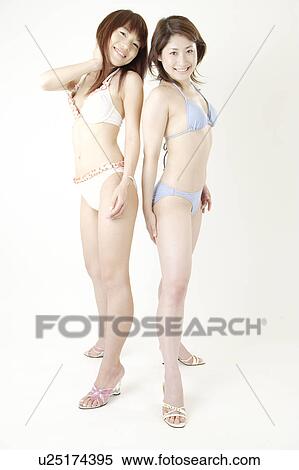 Stock Photography - Portrait of two young women in bikini. Fotosearch