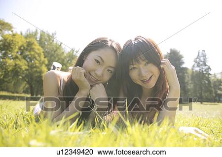 Two young women in bikini smiling to camera View Large Photo Image Stock Image - Two young women in bikini smiling to camera. Fotosearch