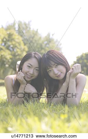 Two young women in bikini smiling to camera View Large Photo Image Stock Image - Two young women in bikini smiling to camera. Fotosearch