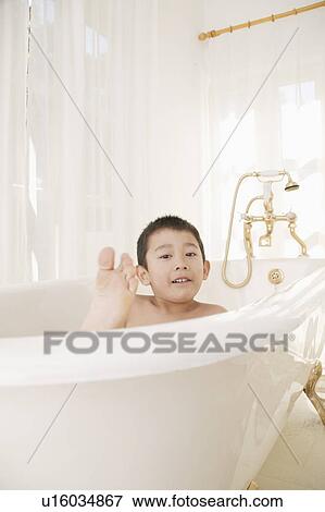 A boy taking bath View Large Photo Image Stock Photo - A boy taking bath. Fotosearch